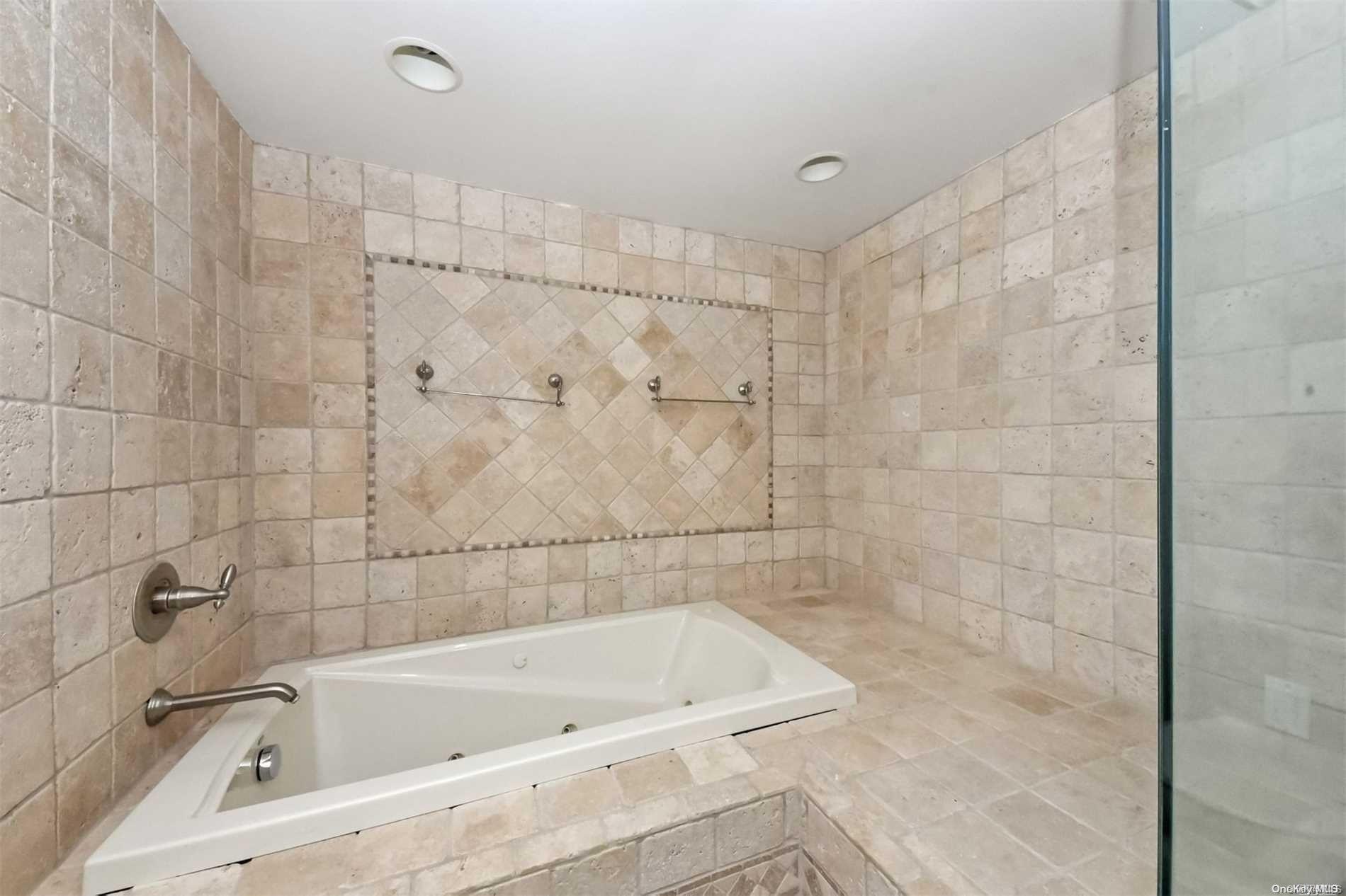 1 Parish Drive Locust Valley, NY 11560 - Photo 13 of 19 a bathroom with a bathtub