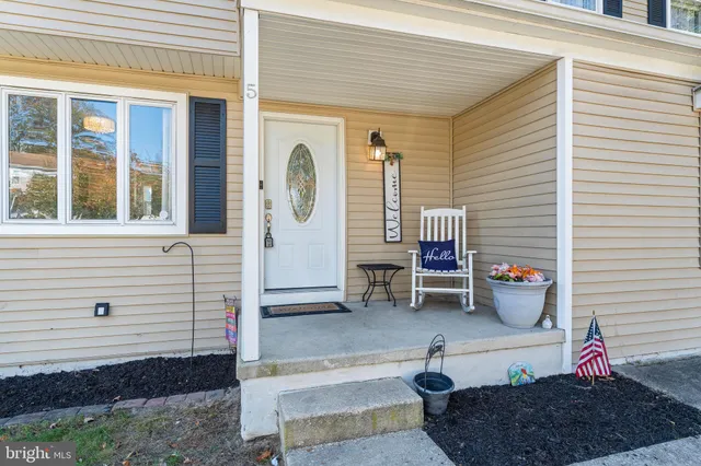 a backyard of a house with outdoor seating