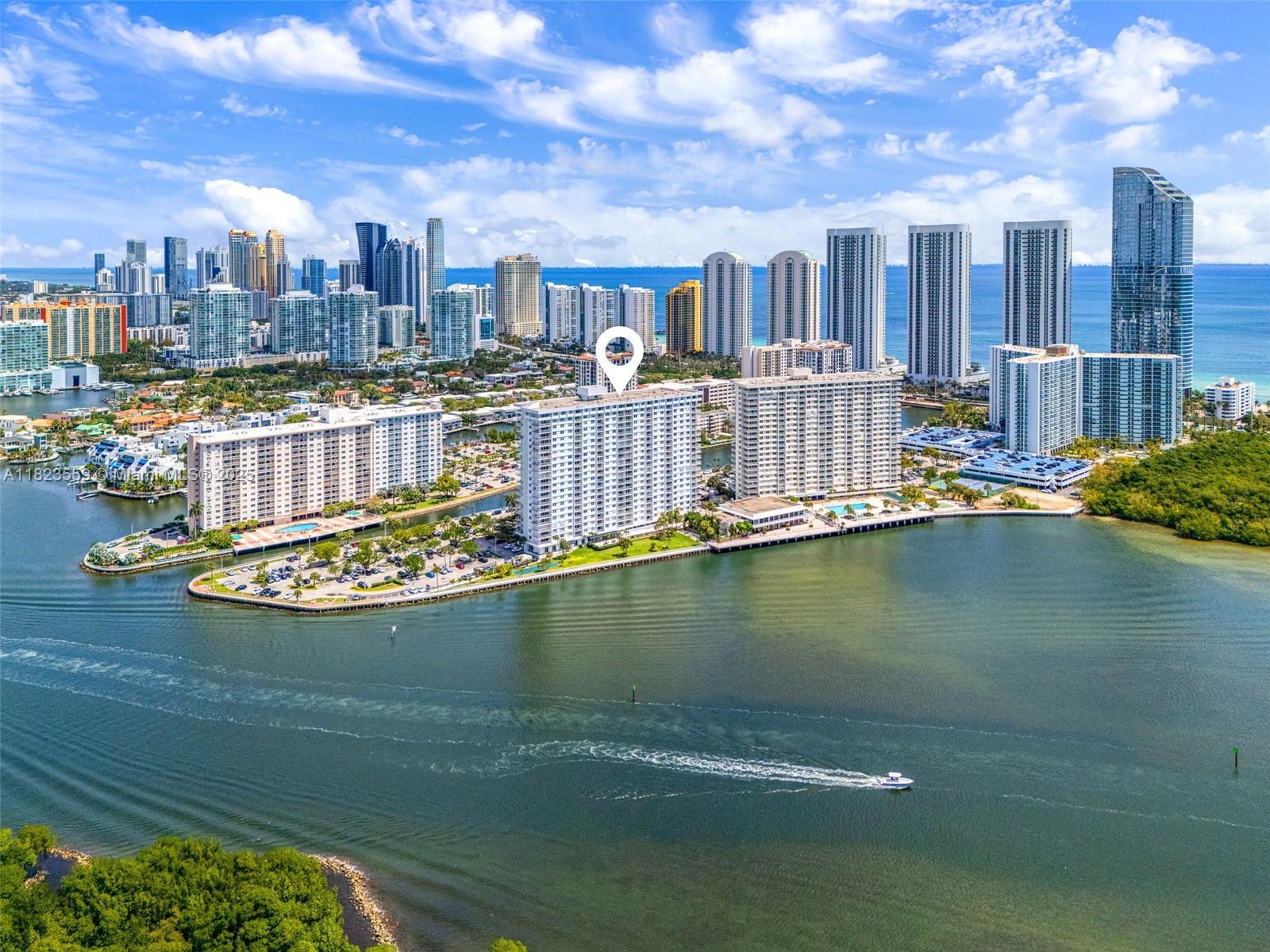 500 Bayview Drive, Unit 228 Sunny Isles Beach, FL 33160 - Photo 3 of 18 a view of a lake with building in front of it