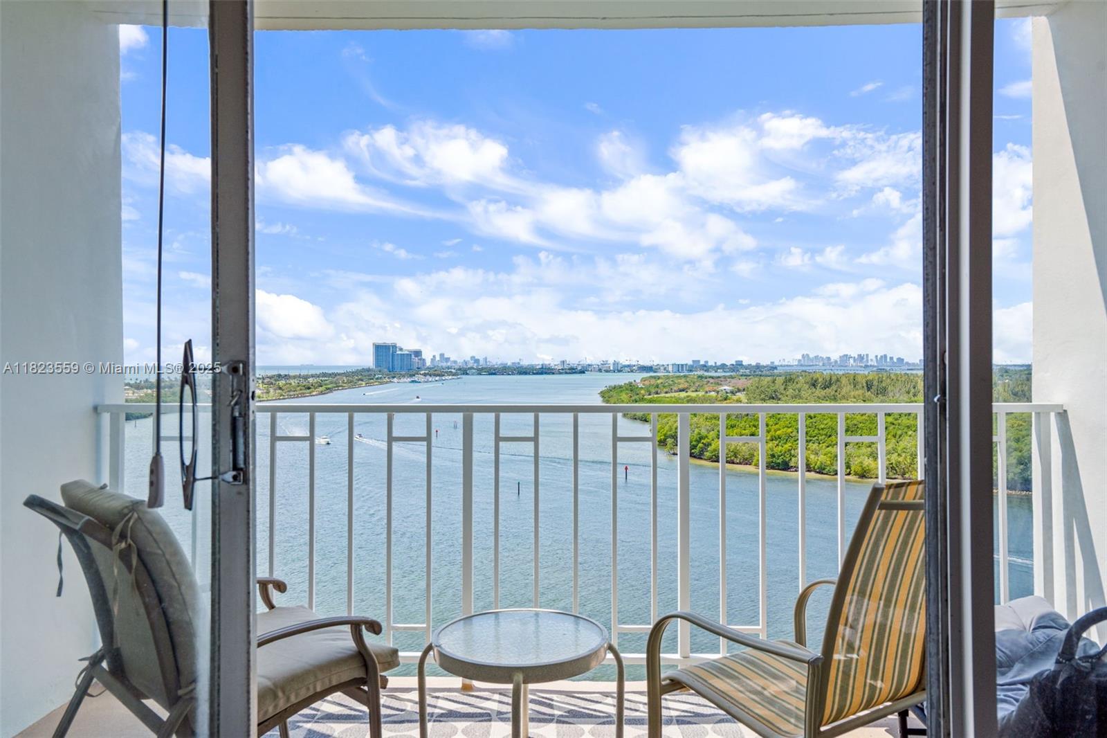 500 Bayview Drive, Unit 228 Sunny Isles Beach, FL 33160 - Photo 4 of 18 a view of a balcony with chair and wooden floor