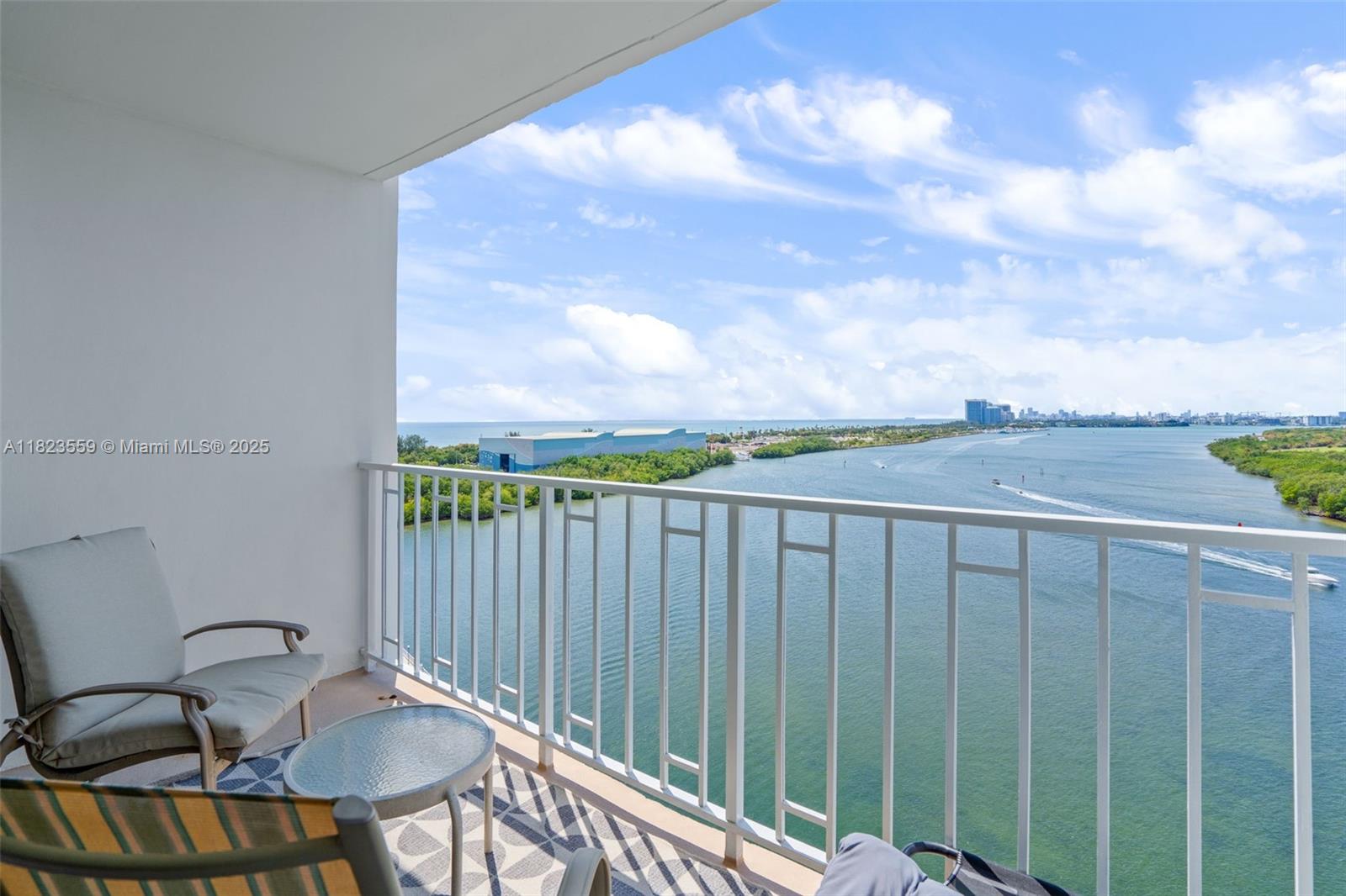 500 Bayview Drive, Unit 228 Sunny Isles Beach, FL 33160 - Photo 6 of 18 a balcony with table and chairs