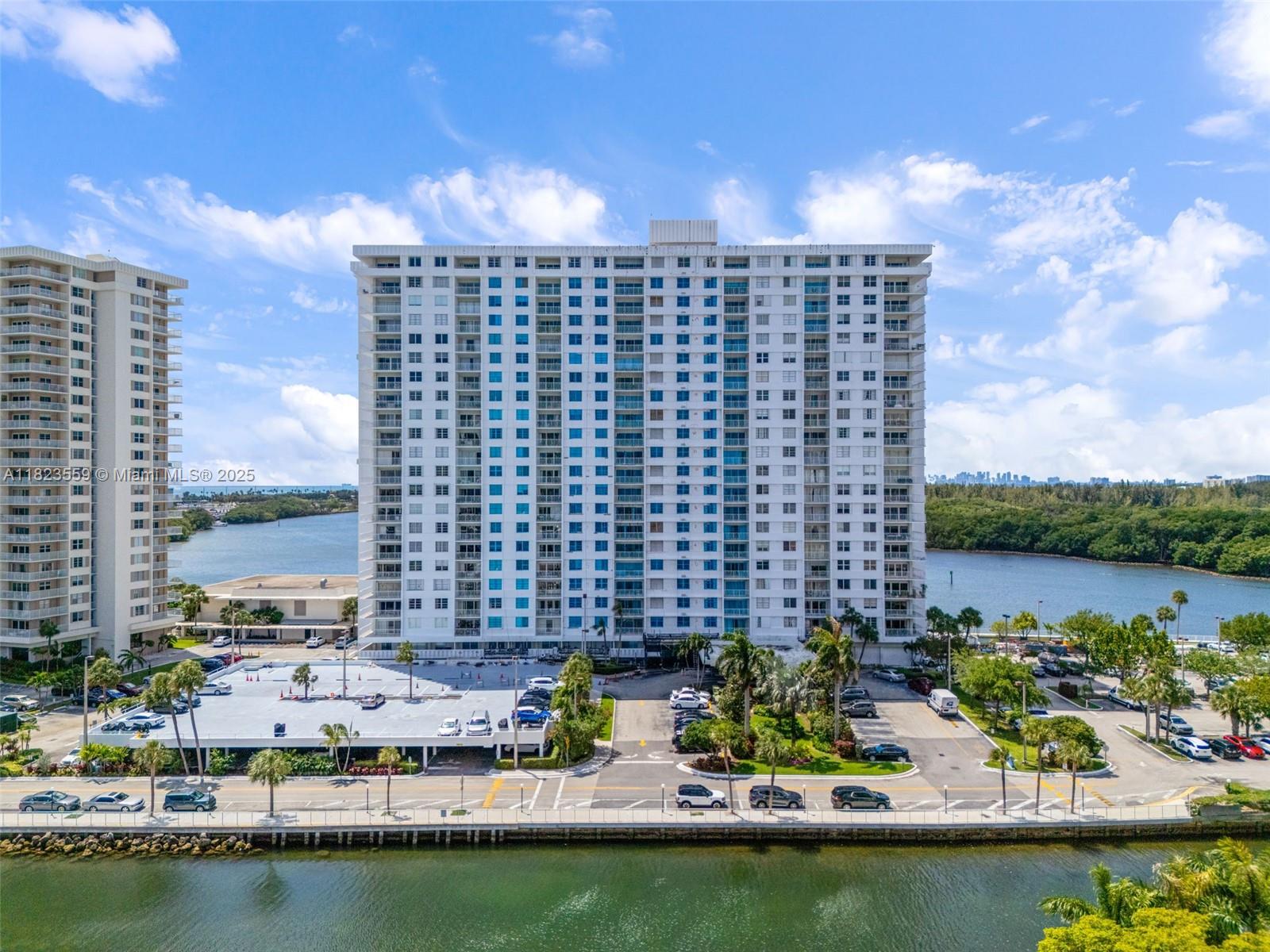 500 Bayview Drive, Unit 228 Sunny Isles Beach, FL 33160 - Photo 7 of 18 a view of a lake with tall buildings