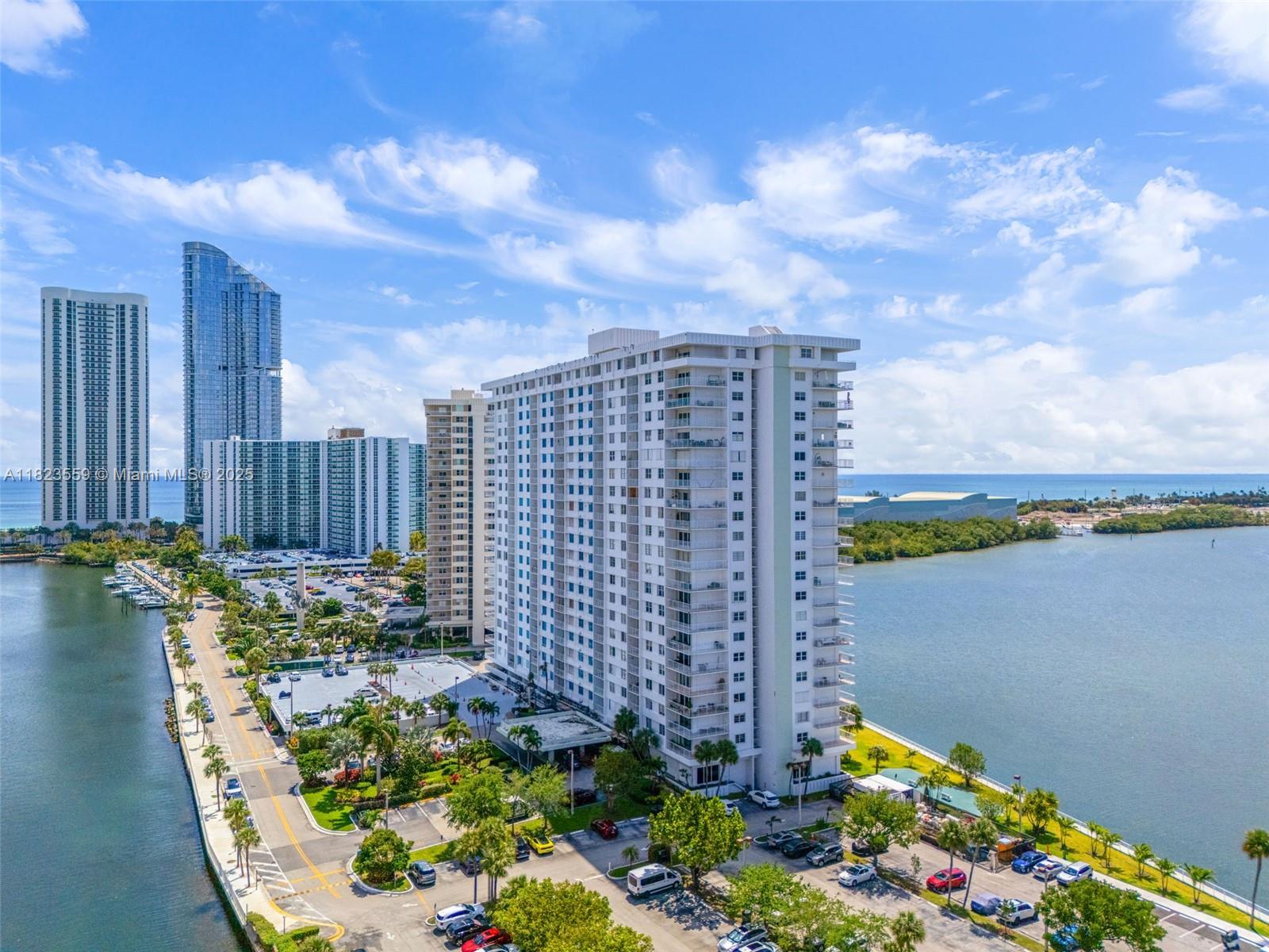 500 Bayview Drive, Unit 228 Sunny Isles Beach, FL 33160 - Photo 8 of 18 a view of a swimming pool with sitting area