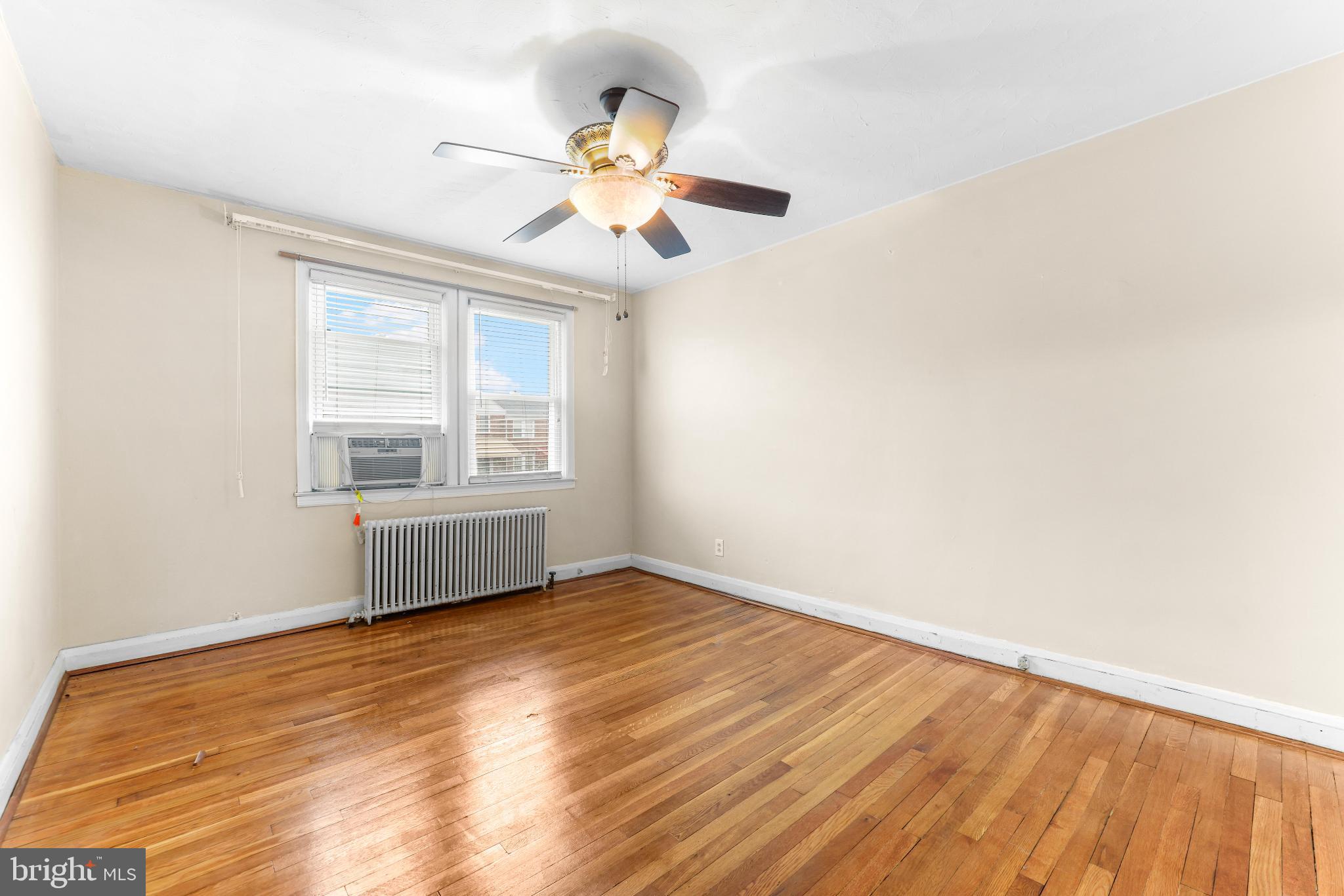 1603 Northgate Road Baltimore, MD 21218 - Photo 14 of 34 Bright and airy room with hardwood floors.