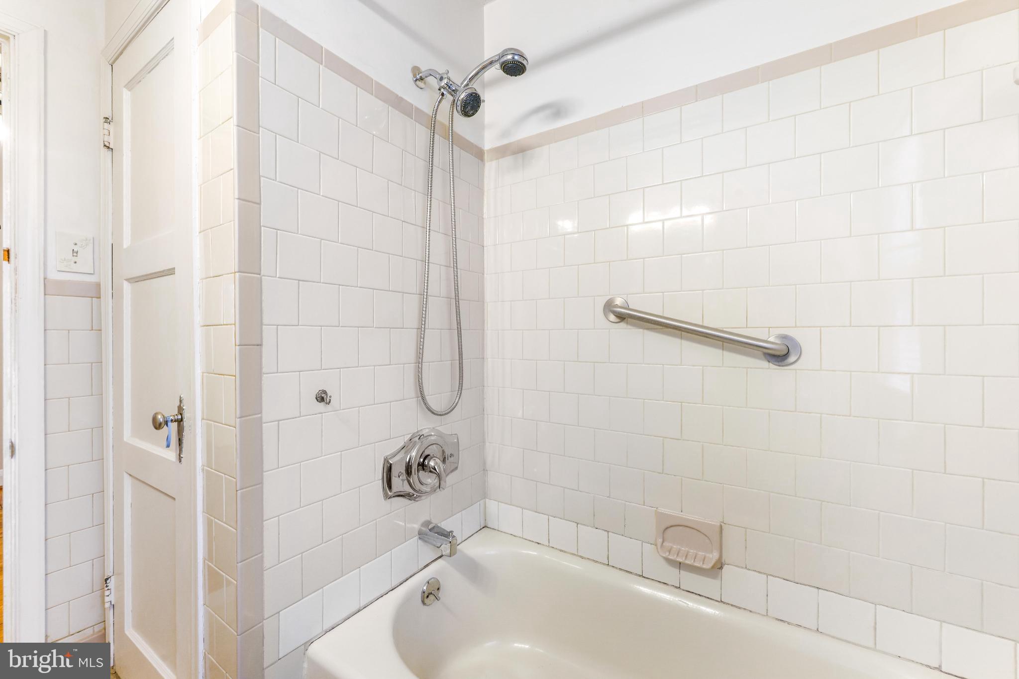 1603 Northgate Road Baltimore, MD 21218 - Photo 22 of 34 Charming tiled bathroom with vintage appeal.