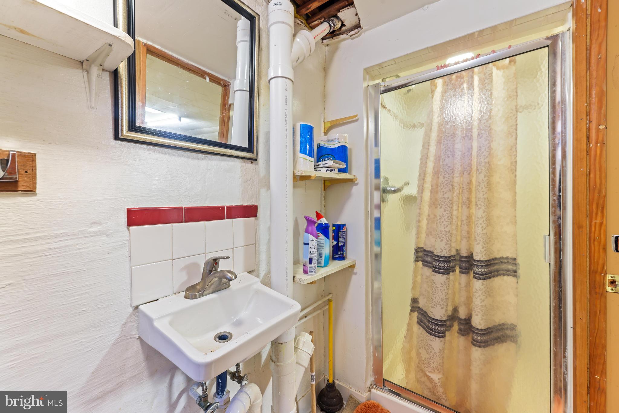 1603 Northgate Road Baltimore, MD 21218 - Photo 27 of 34 Compact bathroom with shower and sink.