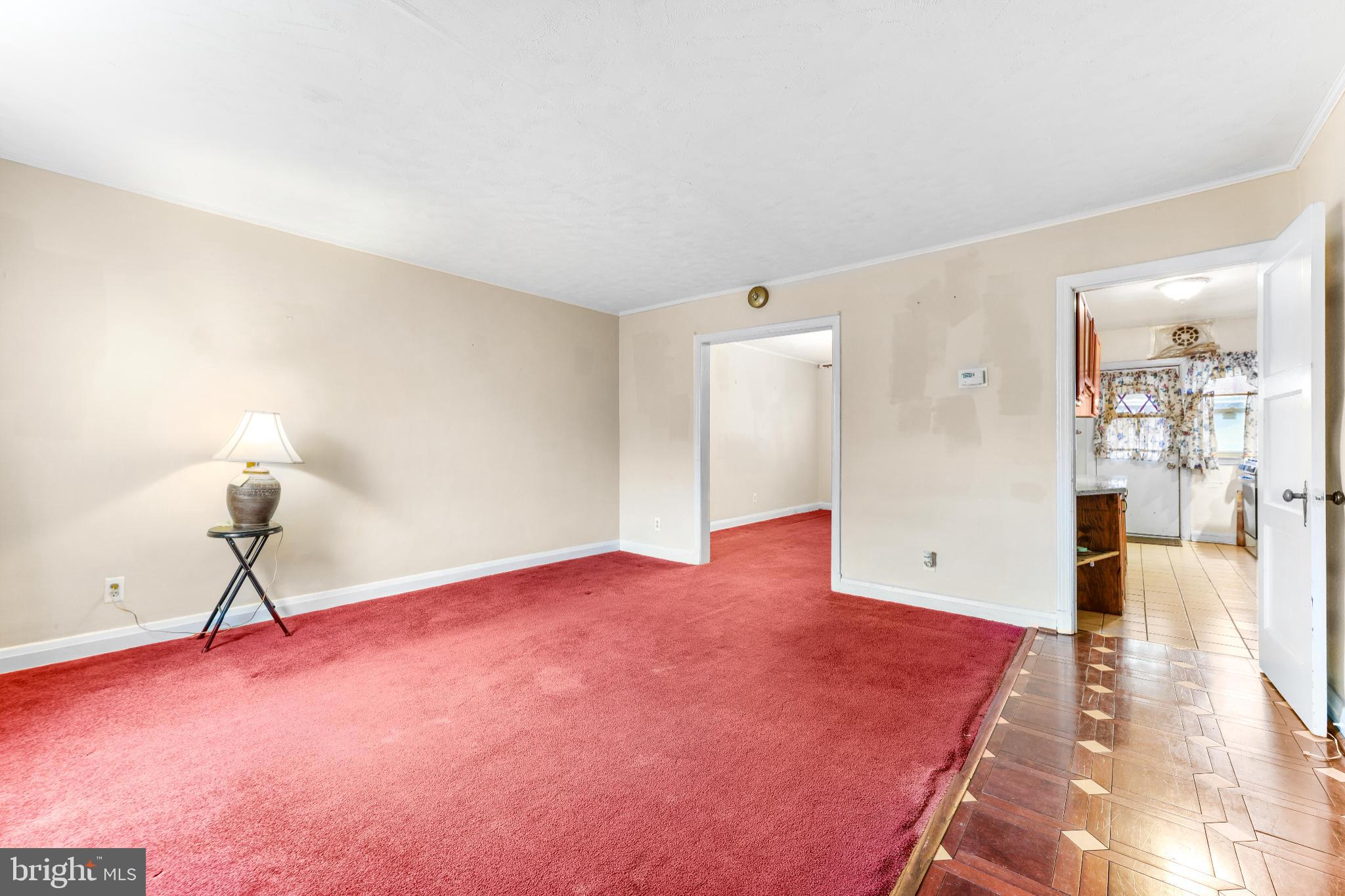 1603 Northgate Road Baltimore, MD 21218 - Photo 3 of 34 Spacious room with warm, inviting tones.
