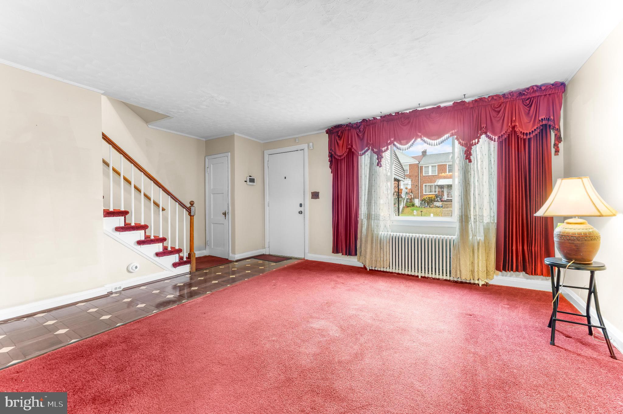 1603 Northgate Road Baltimore, MD 21218 - Photo 6 of 34 Inviting space with vibrant red accents.