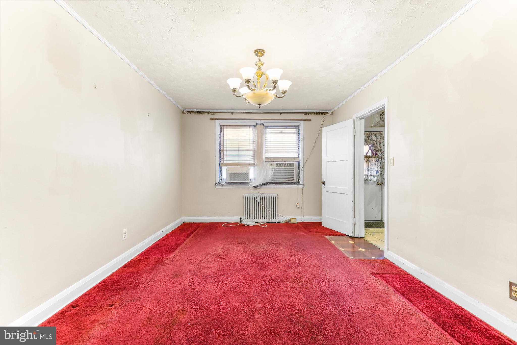1603 Northgate Road Baltimore, MD 21218 - Photo 7 of 34 Spacious room with vibrant red carpet.