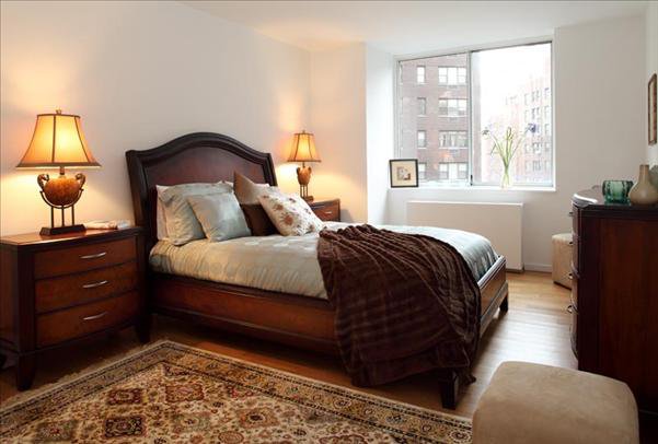 Undisclosed Address Manhattan, NY 10022 - Photo 12 of 14 a bedroom with a bed and a window