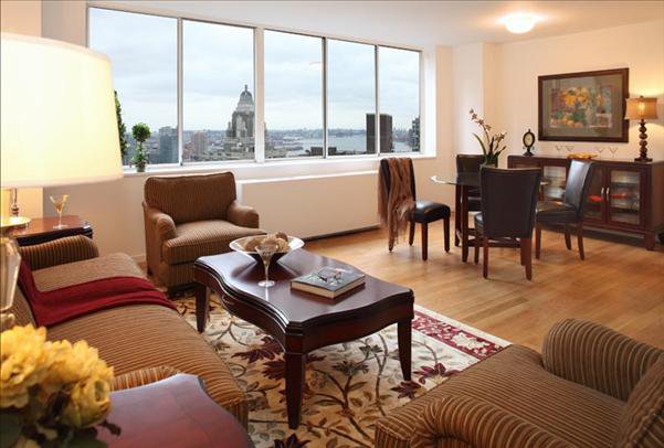 Undisclosed Address Manhattan, NY 10022 - Photo 14 of 14 a living room with furniture and a floor to ceiling window