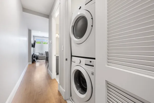 a view of a hallway with washer and dryer