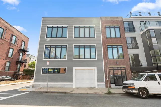 a view of a car parked in front of a building
