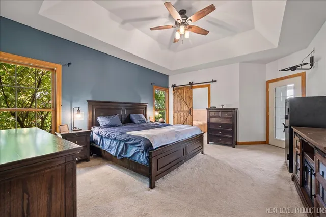 a bedroom with a bed dresser and a window