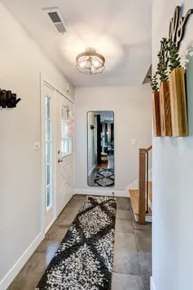 a hallway with a chandelier