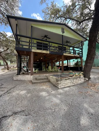 a view of a chairs and table in patio