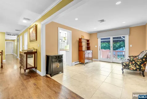 a view of a entryway with furniture and floor to ceiling window