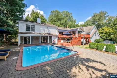 a front view of a house with swimming pool