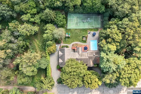 an aerial view of a house with outdoor space