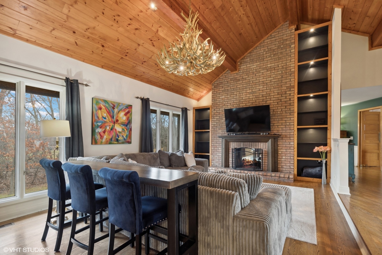 450 Rockefeller Road Lake Forest, IL 60045 - Photo 4 of 27 a view of a dining room with furniture a fireplace and chandelier