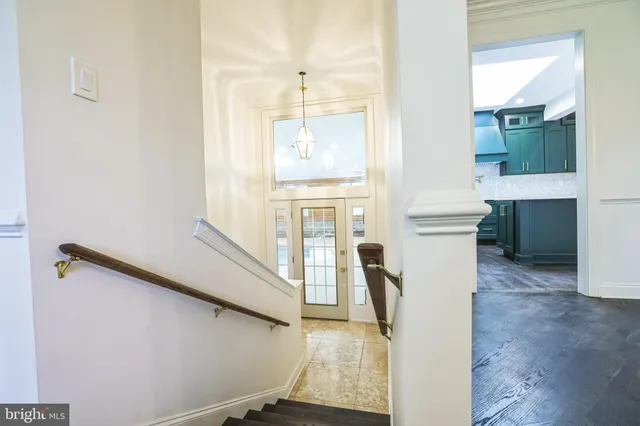 a view of a kitchen with furniture and a fireplace