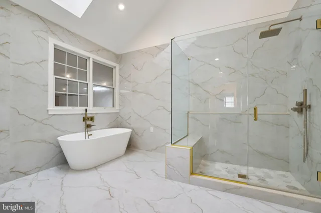 a bathroom with a bathtub and shower