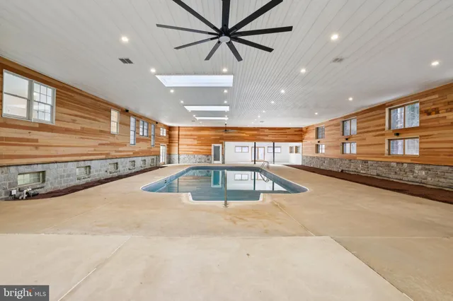 a view of a kitchen with a sink and a potted plant