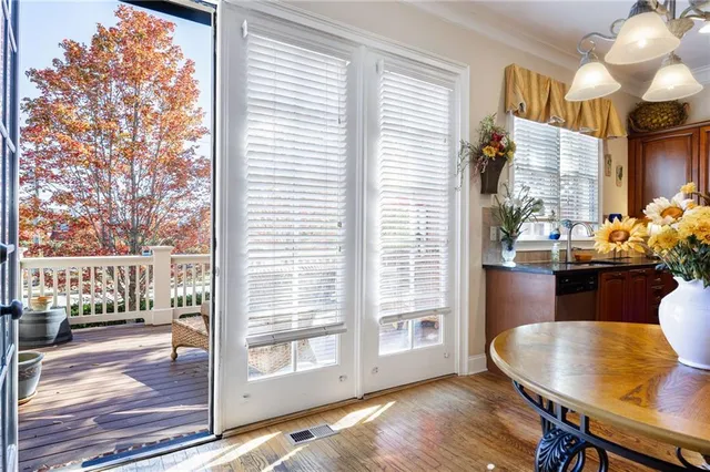 a dining room with furniture and wooden floor