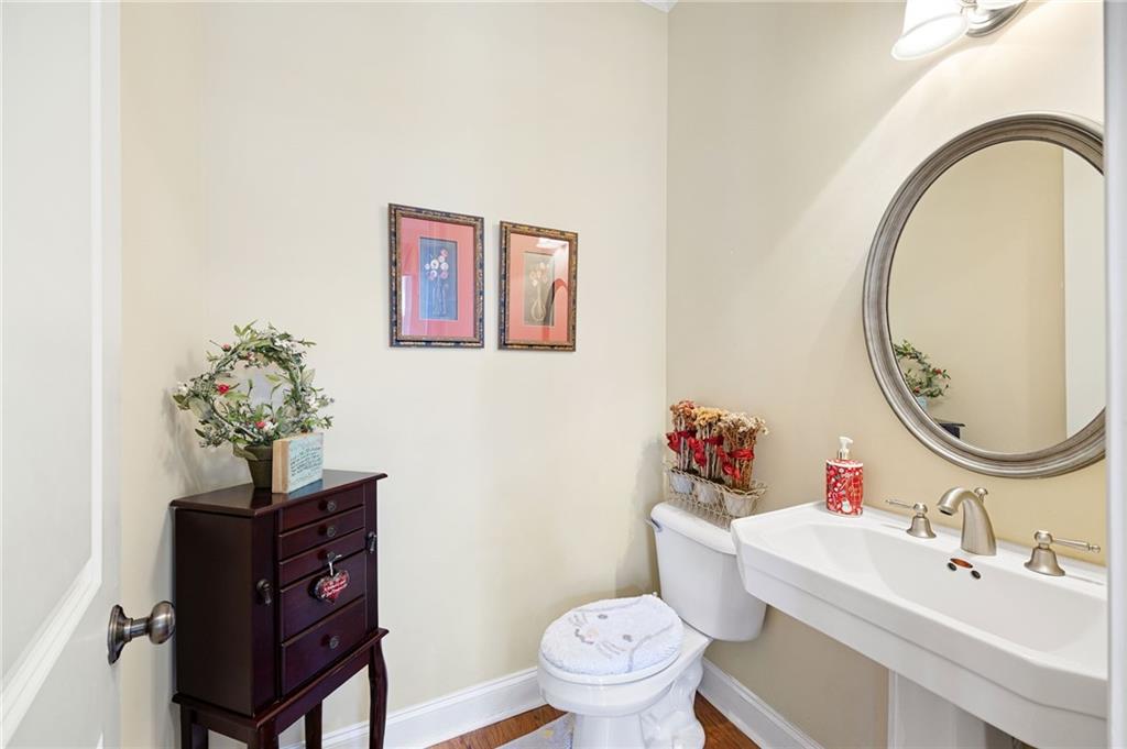 2354 St Davids Square, Unit 3 Kennesaw, GA 30152 - Photo 24 of 39 a bathroom with a toilet a sink and a mirror