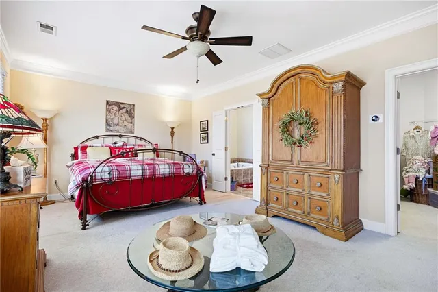 a bedroom with a bed dresser and a window