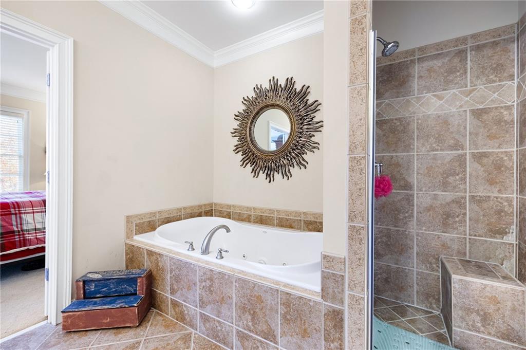 2354 St Davids Square, Unit 3 Kennesaw, GA 30152 - Photo 30 of 39 a bathroom with a tub and a shower