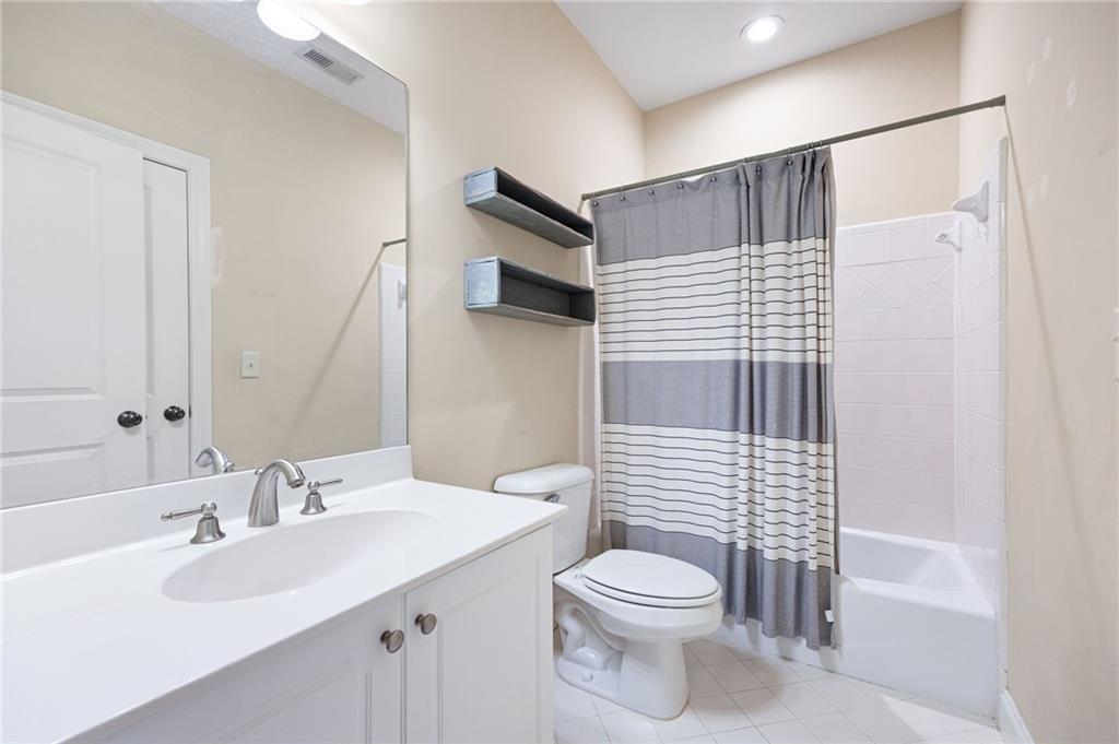 2354 St Davids Square, Unit 3 Kennesaw, GA 30152 - Photo 33 of 39 a bathroom with a sink a toilet and shower