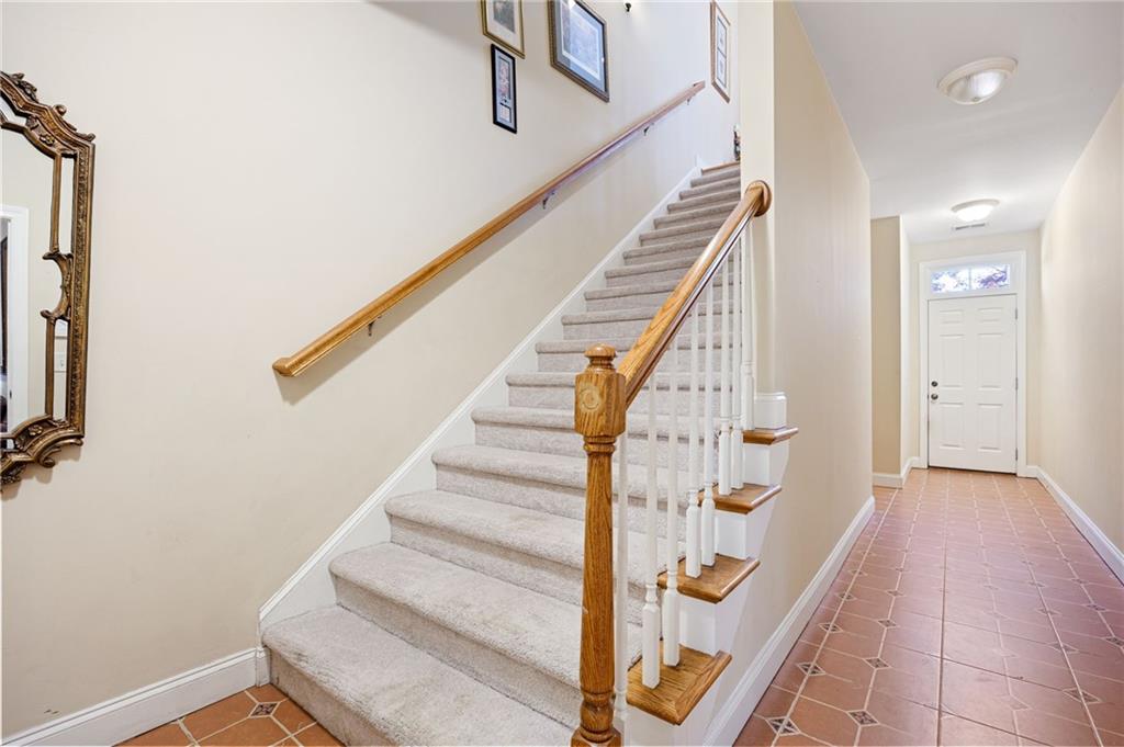 2354 St Davids Square, Unit 3 Kennesaw, GA 30152 - Photo 35 of 39 a view of staircase with railing and white walls