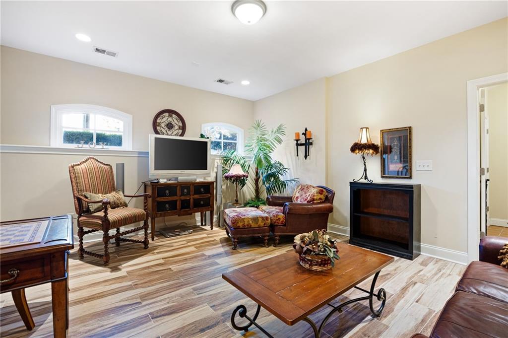2354 St Davids Square, Unit 3 Kennesaw, GA 30152 - Photo 37 of 39 a living room with furniture a flat screen tv and a window