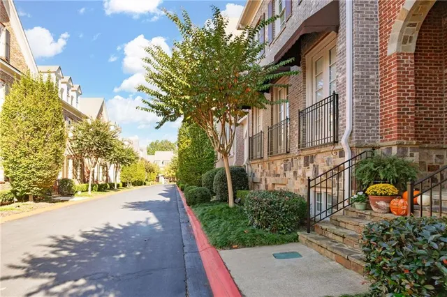 a view of a street with a building in the background