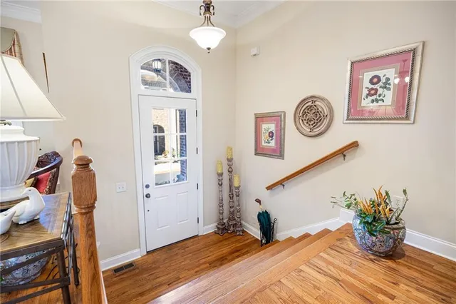 a view of a hallway with paintings on the wall