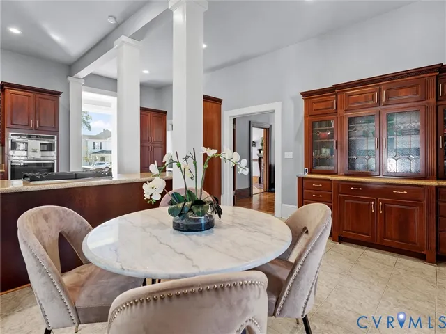 a dining room with furniture and window