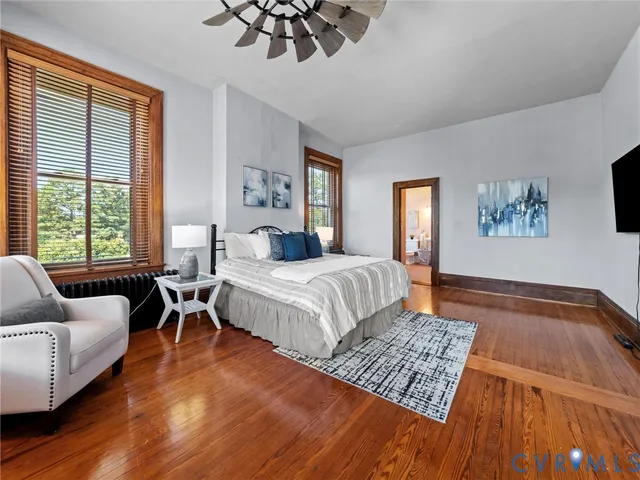 a bedroom with a large bed and a couch