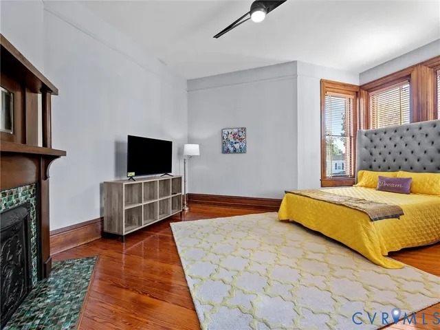 a bedroom with a bed and flat screen tv