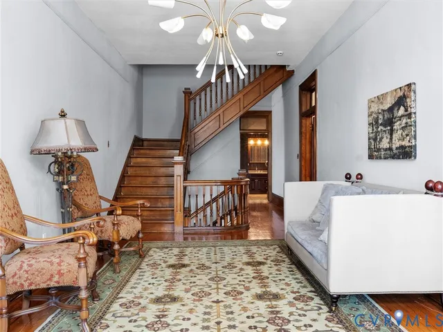 a living room with furniture and a rug