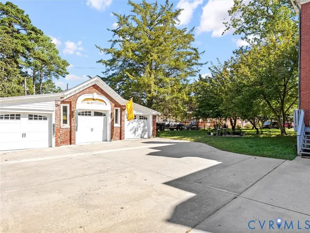 a view of white house with a yard