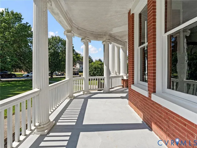 a view of a balcony with wooden floor