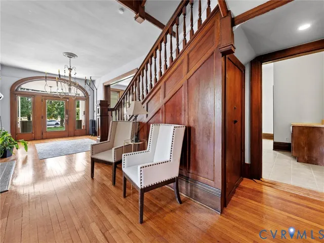 a view of a livingroom with furniture and hardwood floor