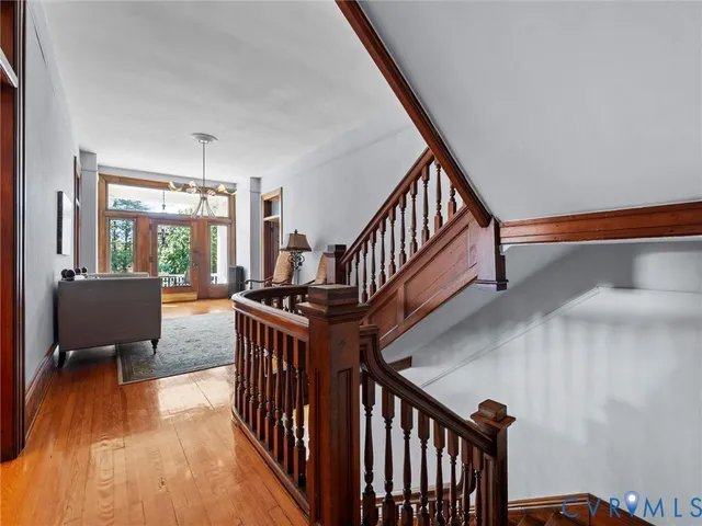 a view of entryway livingroom and hall with wooden floor