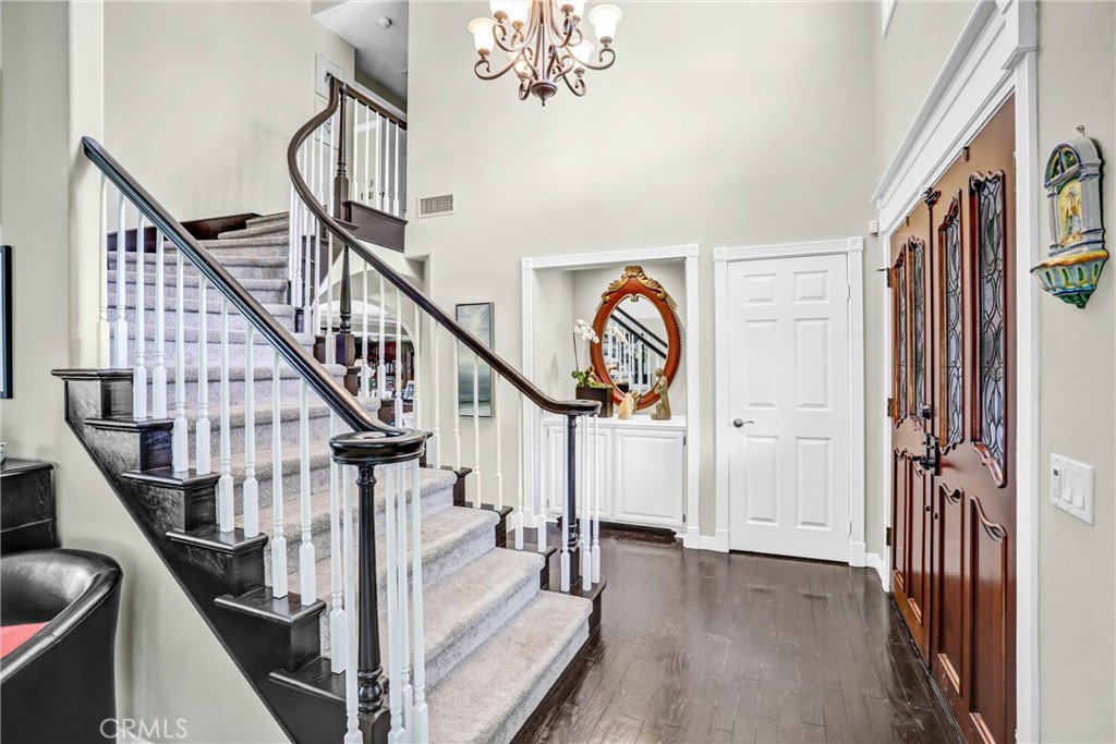 5787 Ridgeway Road Rancho Cucamonga, CA 91701 - Photo 11 of 56 a view of entryway and hall with wooden floor