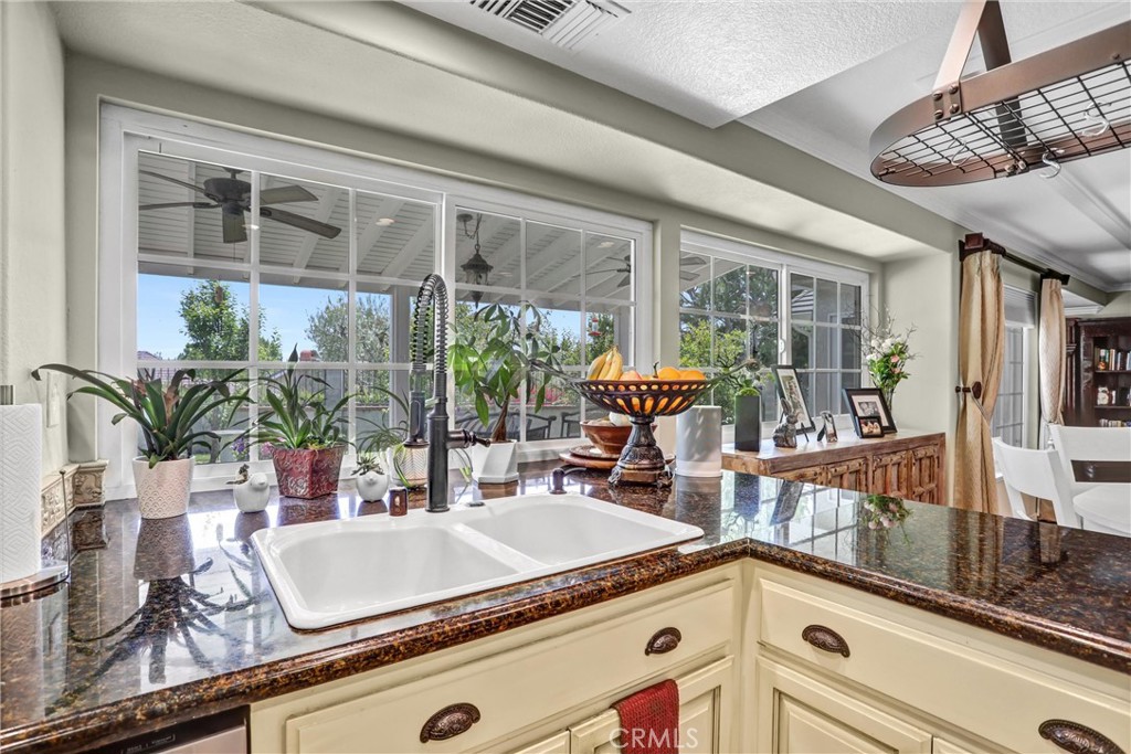 5787 Ridgeway Road Rancho Cucamonga, CA 91701 - Photo 15 of 56 a kitchen with a sink and a large window