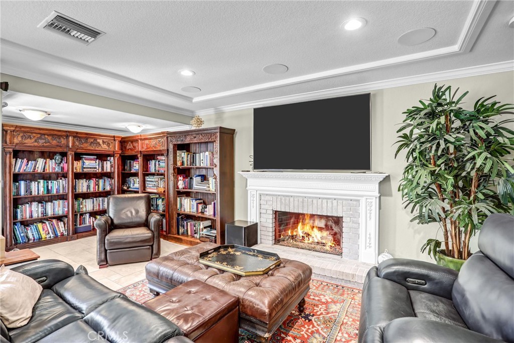 5787 Ridgeway Road Rancho Cucamonga, CA 91701 - Photo 20 of 56 a living room with furniture and a fireplace