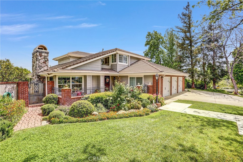 5787 Ridgeway Road Rancho Cucamonga, CA 91701 - Photo 2 of 56 a front view of a house with garden