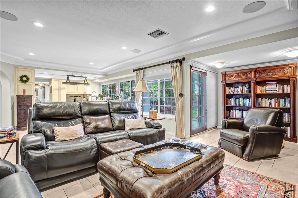 5787 Ridgeway Road Rancho Cucamonga, CA 91701 - Photo 21 of 56 a living room with furniture and a book shelf