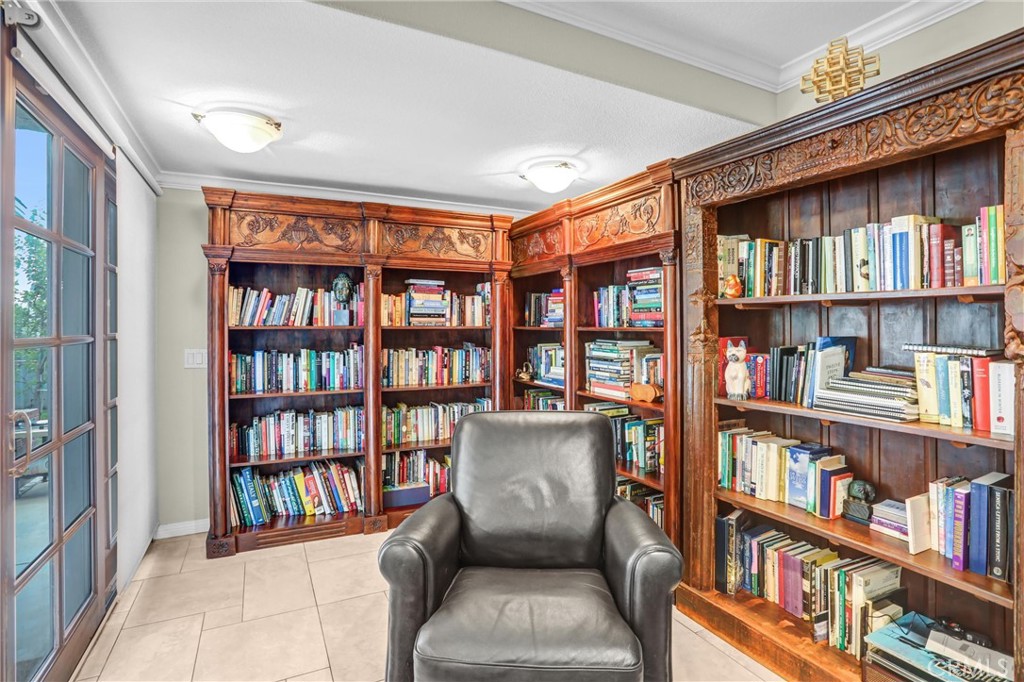 5787 Ridgeway Road Rancho Cucamonga, CA 91701 - Photo 23 of 56 a living room with a book shelf and a book shelf